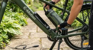 Alt text for image 3: Close-up of a removable lithium-ion battery on an affordable electric bike showing charging port details.