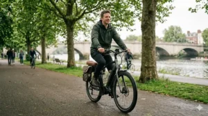 Alt text for image 5: A cyclist in a relaxed, upright position on a comfortable electric bike, showing minimal back strain and relaxed shoulders on a leafy UK cycle path.