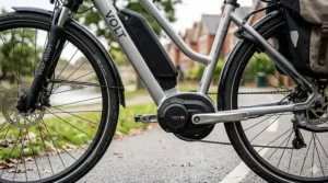 Close-up of the easy-to-reach handlebar controls on an adapted electric bike, designed for riders with limited hand mobility.