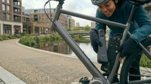 A portable sub 15kg electric bike folded for storage on a London commuter train.
