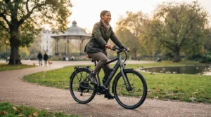 A cyclist enjoying a smooth, assisted ride through a British park on a 36v ebike.