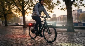 Bright integrated LED front and rear lights illuminating a commuter ebike for safe evening riding.