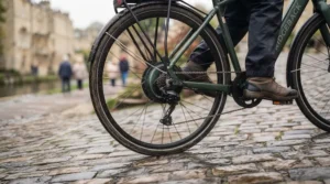 Using walk assist mode for extra stability with an e-bike on a damp path.