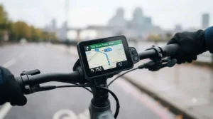 Close-up of a handlebar-mounted screen showing turn-by-turn navigation on a GPS-enabled commuter e-bike.