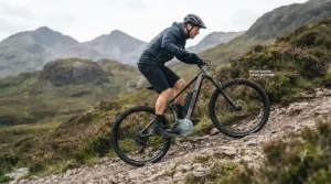 Cyclist tackling a steep incline on a mountain ebike equipped with advanced torque-sensing technology.