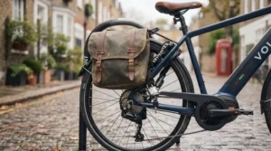 The Volt e-bike secured to a Sheffield stand with a heavy-duty chain lock, with a pannier bag attached.