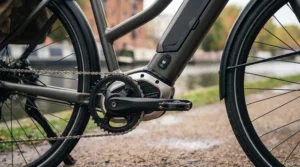 LCD dashboard screen on an adjustable fit ebike displaying speed, battery percentage, and pedal-assist modes in miles per hour.