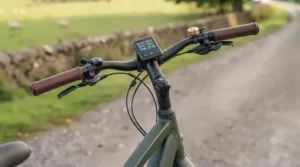 Adjustable handlebars on a touring electric bike allowing customisation for a relaxed, upright sitting position.