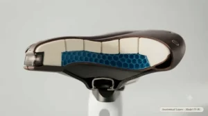 Cutaway view showing memory foam layers inside the most comfortable ebike saddle for long-distance riding.