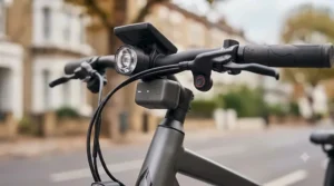 Close-up view of smart handlebar sensors used for automatic accident tracking on a connected electric bike.