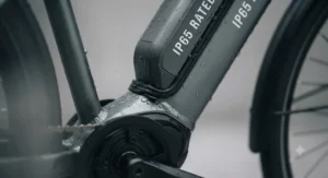 Close-up of a sealed IP65-rated electric bike battery casing designed to withstand heavy rain and road spray.