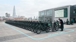 Fleet of commercial electric bikes lined up ready for dispatch to support sustainable urban logistics in the UK.