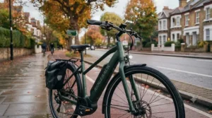 Fully equipped commuter electric bike with mudguards, integrated lights, and heated grips.