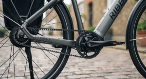 Close-up of a carbon belt drive system on an e-bike, showing a clean, oil-free drivetrain ideal for all-weather British cycling.