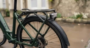 Rear wheel mudguard and built-in cargo rack combination on an electric bike designed for wet weather riding.