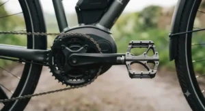 Close-up of wide-platform e-bike pedals designed for enhanced foot grip and joint relief.