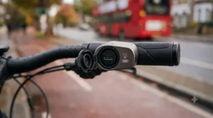 Detailed view of the rechargeable battery port integrated into the handlebar of an e-bike.