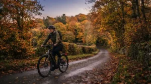 A rural cyclist staying safe with an electric bike hi-vis visibility kit on a countryside lane